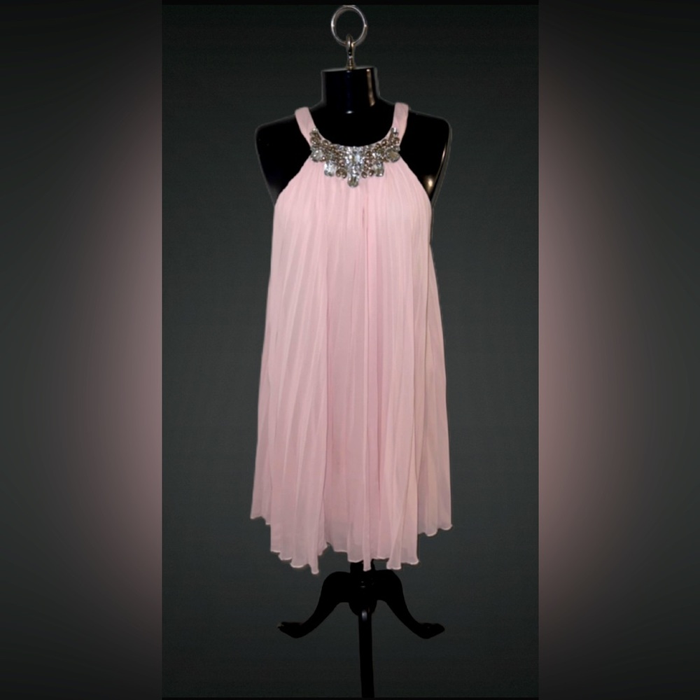 Accordion, knee length cocktail dress with jeweled neckline.